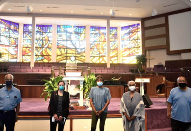 Masked individuals in a house of worship
