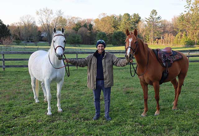 Sammy poses with his horses